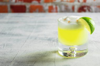 Pisco Sour Cocktail in Glass with Lime clipart