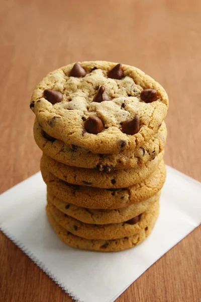 Stack of Chocolate Chip Cookies on Parchment Paper — Stock Photo, Image