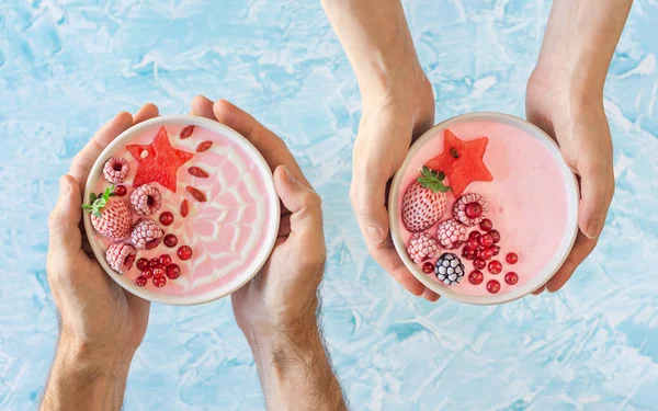 Male Female Hands Holding Two Pink Berry Yogurt Smoothie Bowls — Stock Photo, Image