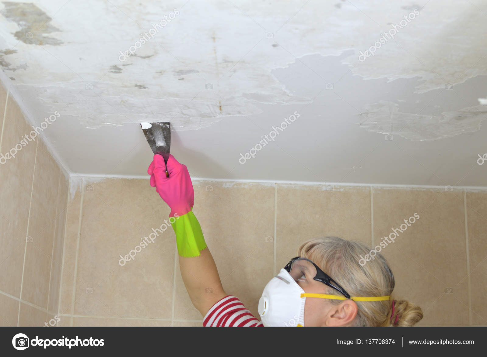 Woman Peeling A Ceiling Stock Photo C Bane M 137708374