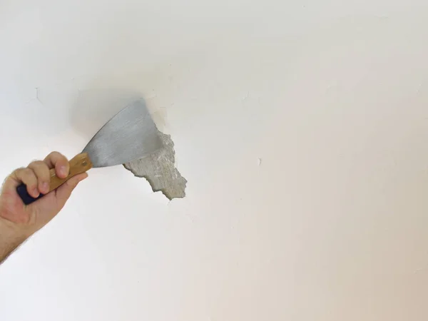 Man's Hand Peeling a Ceiling — Stock Photo, Image