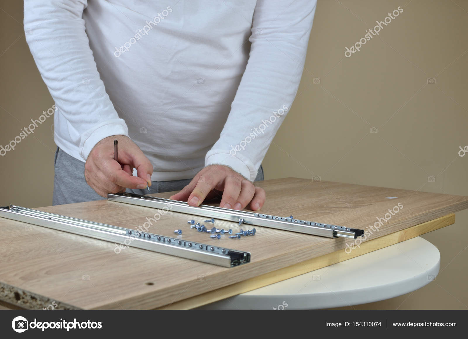 Installing Drawer Slides On A Cabinet Stock Photo C Bane M