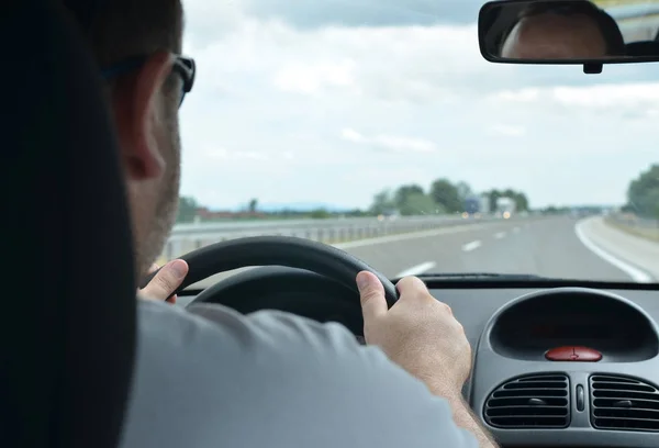 Man driving a car on a motorway — Stock Photo, Image