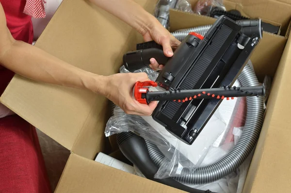 Unpacking modern vacuum cleaner — Stock Photo, Image