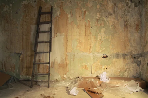 abandoned room without repair. wall with ragged wallpapers.