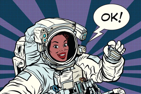 [Ok] を宇宙服のジェスチャーの女性宇宙飛行士 — ストックベクタ