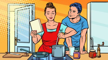Karı koca mutfakta yemek pişiriyor.
