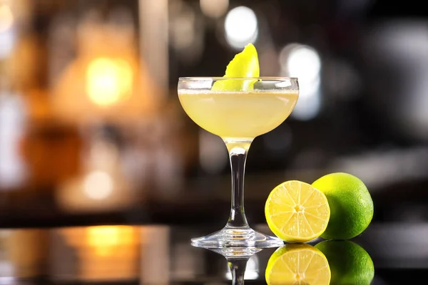 Closeup image of daiquiri cocktail decorated with lemon at bar c