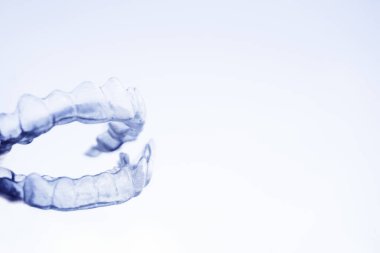 Transparent plastic splint for dental alignment clipart