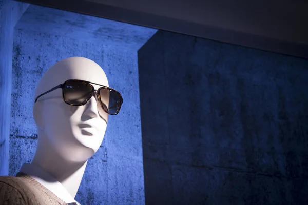 Unisex mannequin head with glasses. No people