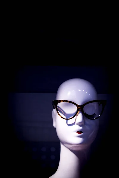 Unisex mannequin head with glasses. No people