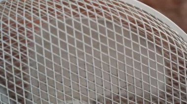 White fan works with dirty blades