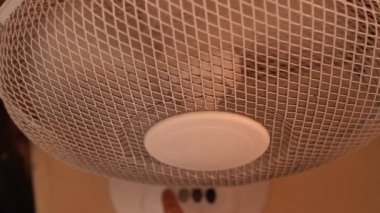 White fan works with dirty blades