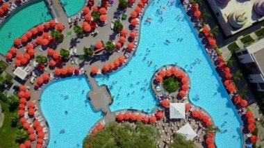 Top view of pools with sun loungers and parasols