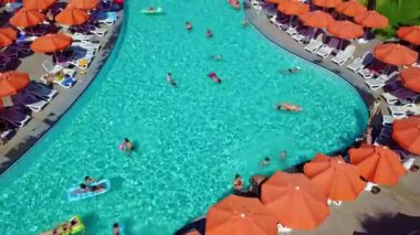 Top view of pools with sun loungers and parasols