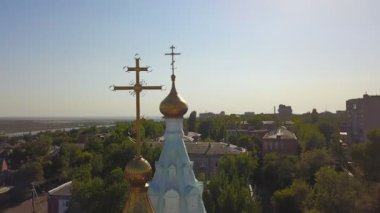 The dome of the Church and the cross top view over
