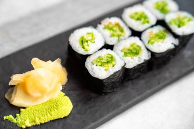 Roll rice, nori, cucumber. japanese. Ginger wasabi