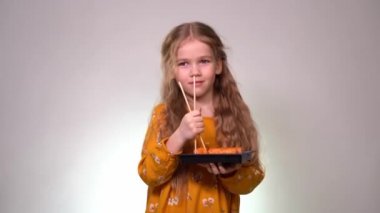 Girl blonde dancing with rolls and sticks in hand