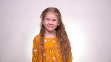 rejoices and Leaps in the girl in the orange dress