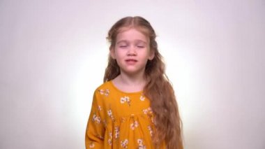 Toothache a little girl with long blonde hair