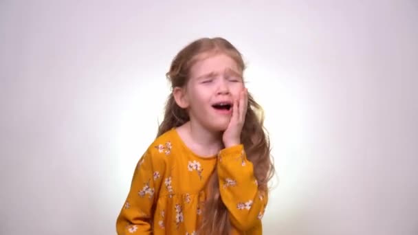 Strong Toothache little girl with long blonde hair — Stock video