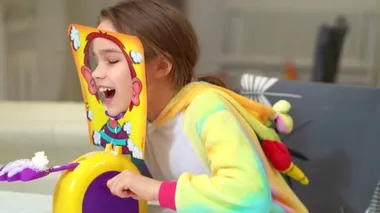 little girl plays pie in the face