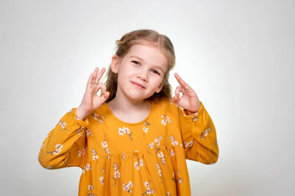 Ok Sign shows little blonde girl fingers 2 hands. — Stockfoto