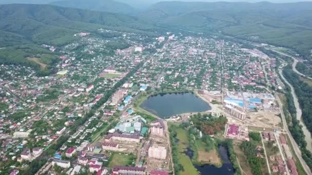 Over town and lake Krugloe, city Goryachy Kluch, — Wideo stockowe