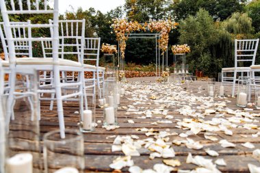 a arch for outdoor wedding ceremony. petal