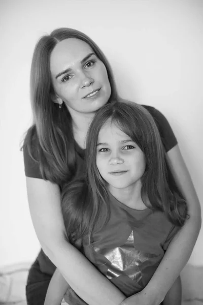 Mum and daughter hug each. black-white. Stock Picture