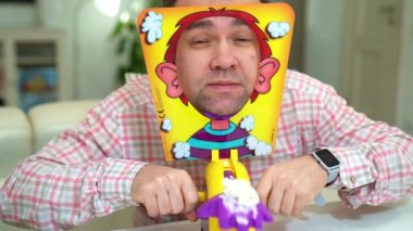 a Man playing a pie in the face