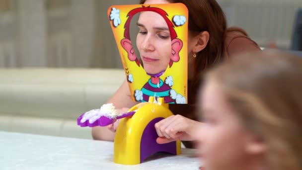 Woman in a brown t-shirt playing a pie in the face — Stock video