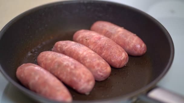 Sausages are fried in pan. semi-finished products. — Stock Video