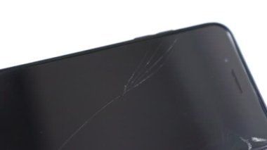 broken safety glass on the black smartphone.