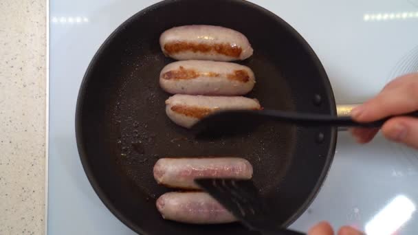 Flip sausages fried in pan. semi-finished products — Stock Video