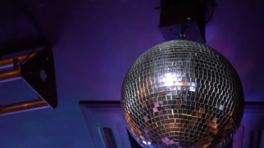 mirror disco ball spinning on the ceiling