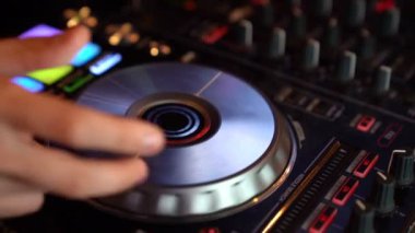 DJ mixing console hand. Music at the festival.