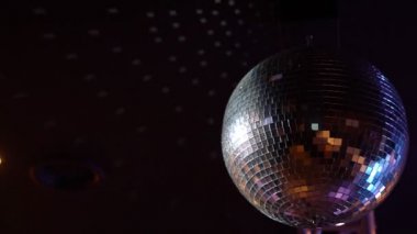 mirror disco ball spinning on the ceiling.