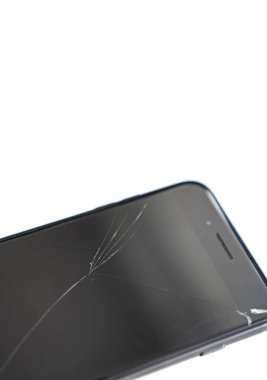 broken safety glass on the black phone.