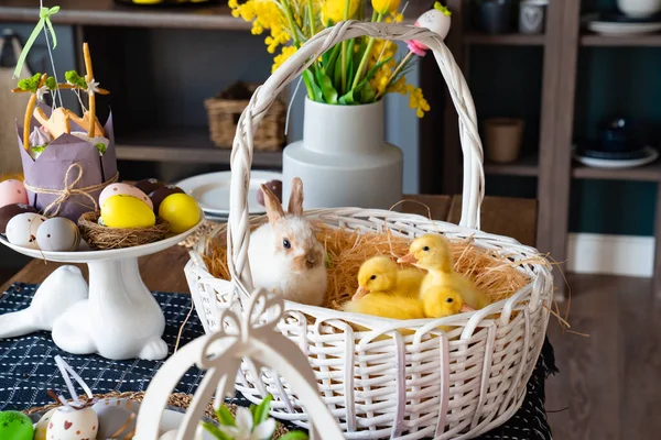 a white Bunny and three duck white basket on table