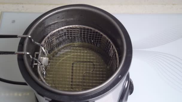 Basket for home mini deep fryer oil. view top. — Stock Video