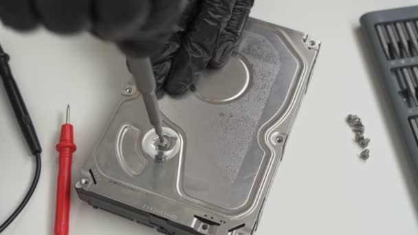 Computer Hard Drive. removes seal. black gloves — Stock Video