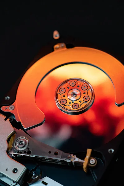 Disassembled hard drive computer, mirror effect