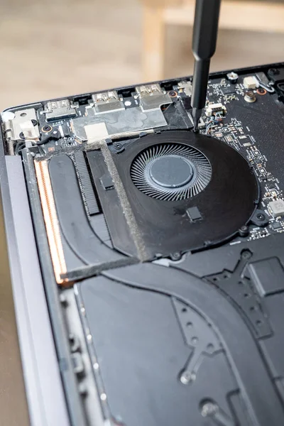 install the fan after cleaning the dust on laptop