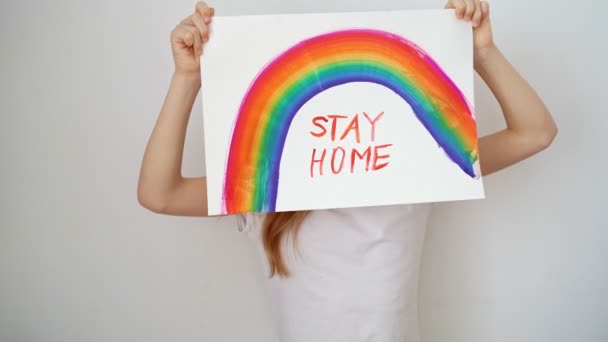 Happy teen girl drew rainbow and poster stay home. — Stock Video