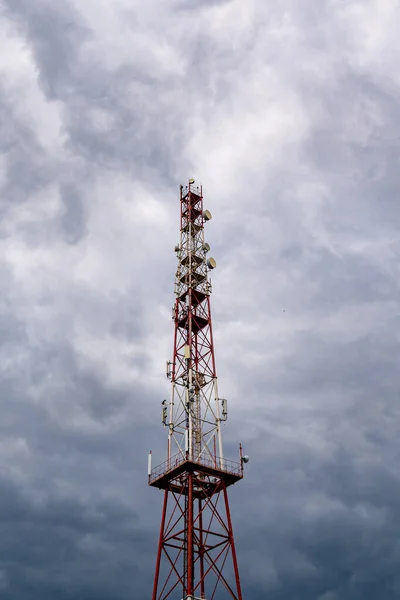 Telecommunication tower on cloud sky background — Stock Photo, Image