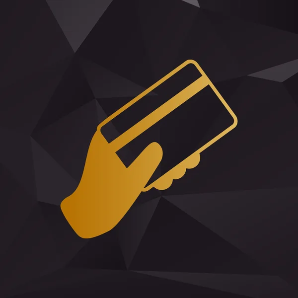 Χέρι που κρατά μια πιστωτική κάρτα. Χρυσή στυλ σε φόντο με πολύγωνα. — Διανυσματικό Αρχείο