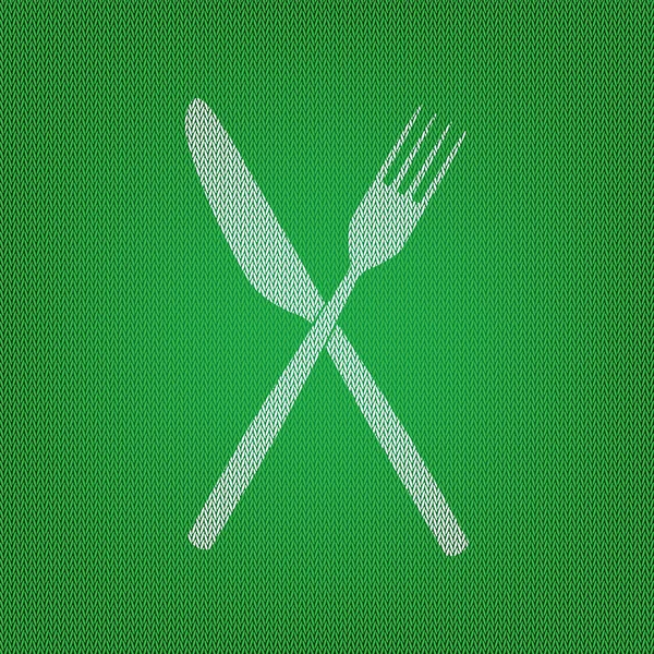Señal de tenedor y cuchillo. icono blanco en la prenda de punto verde o de lana — Vector de stock
