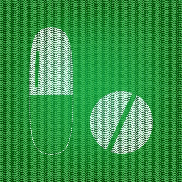 Medicinsk piller logga. vit ikon på gröna stickat eller ylle c — Stock vektor