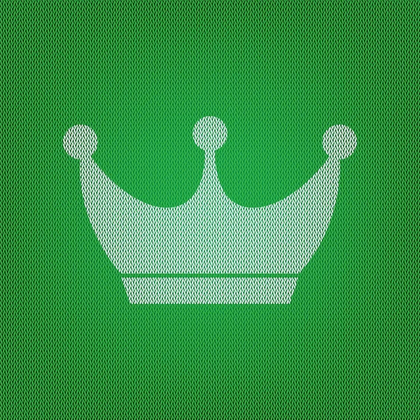 King crown sign. white icon on the green knitwear or woolen clot — Stock Vector